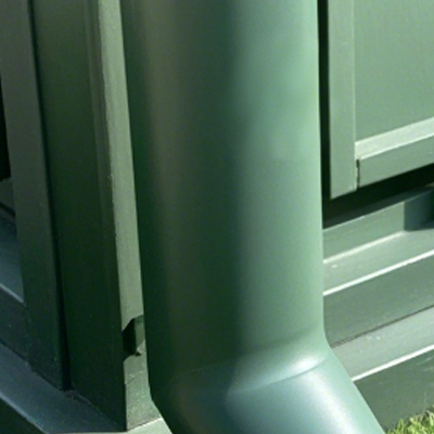 Smooth green powder‑coated gutter downspout for conservatory rain drainage