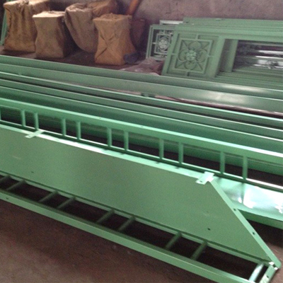 Stacked powder‑coated steel frame components for Victorian greenhouse kit