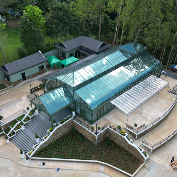 Aerial view of large Victorian glass greenhouse sunroom for commercial event venue