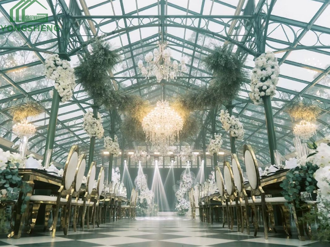 Green victorian glass conservatory interior for wedding banquet venue with chandeliers