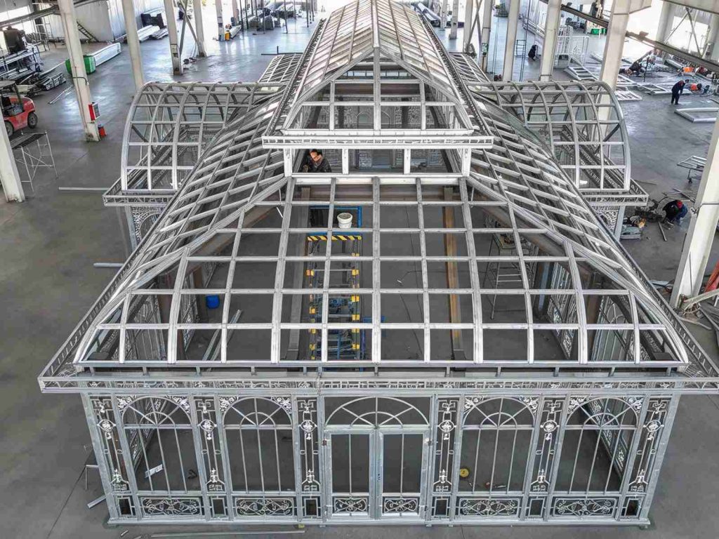 Aerial top view of Victorian conservatory steel frame, pre-assembled roof and decorative window grilles **Description**: Overhead aerial shot of Victorian