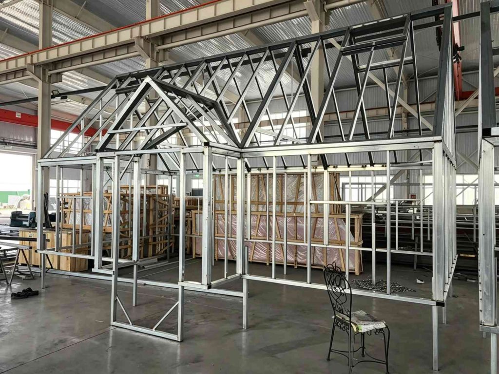 Galvanized steel truss frame for Victorian‑style greenhouse in production plant