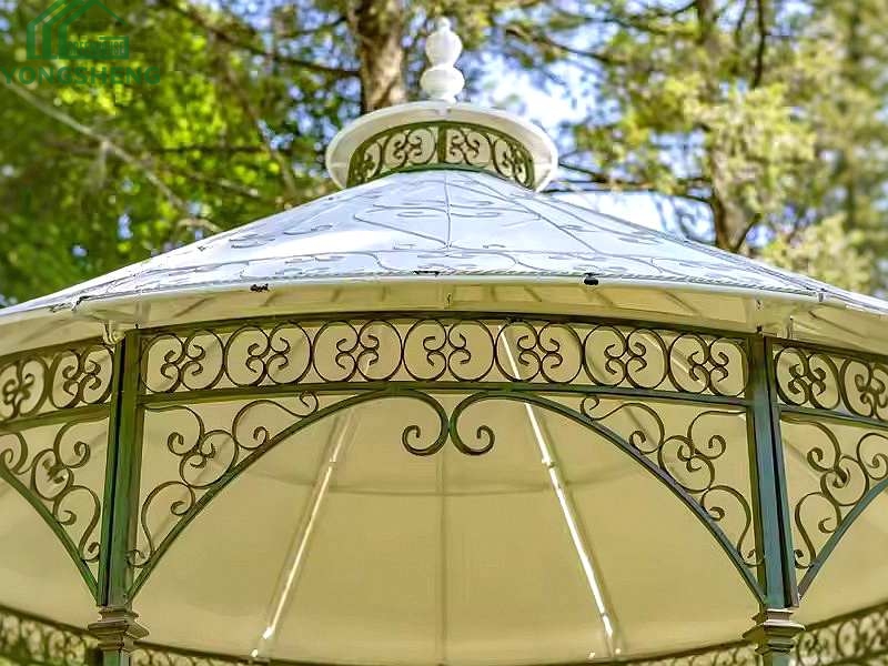 Close‑up view of carved scroll metal roof details on classic outdoor garden gazebo