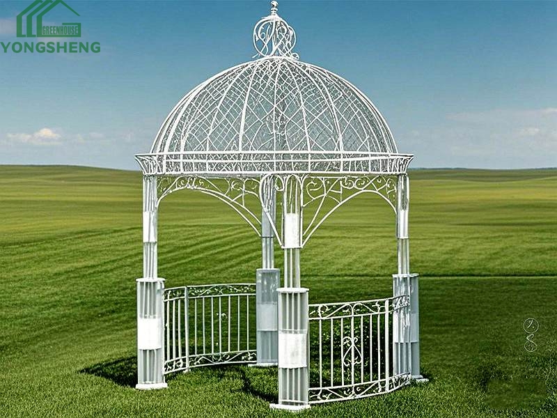 White dome‑shaped luxury metal gazebo with fence railing on open green grass lawn