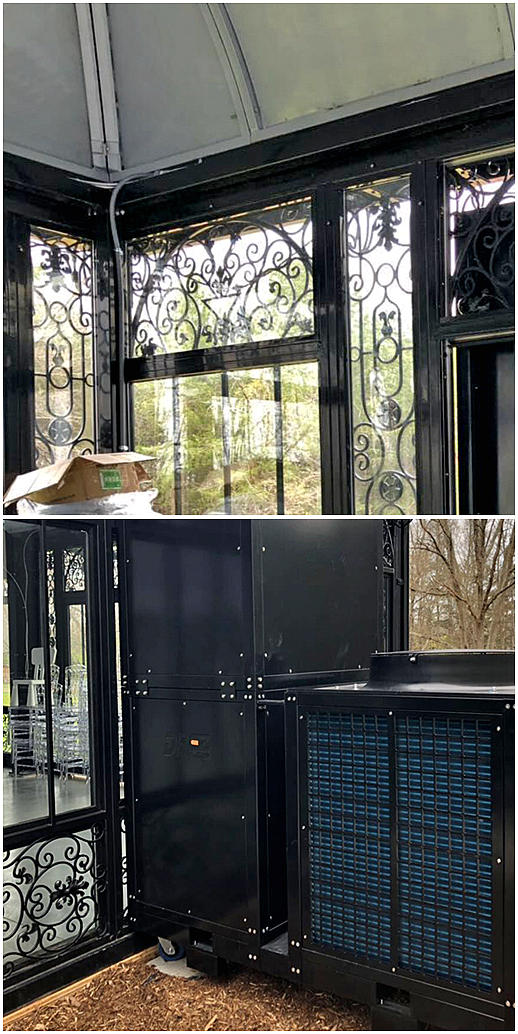 Black Victorian greenhouse with hot-dip galvanized steel frame in a garden setting