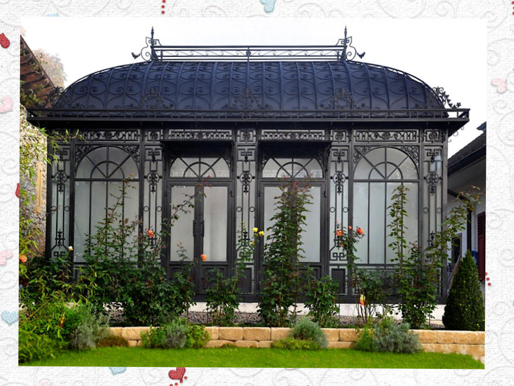 Black Victorian greenhouse with hot-dip galvanized steel frame in a garden setting