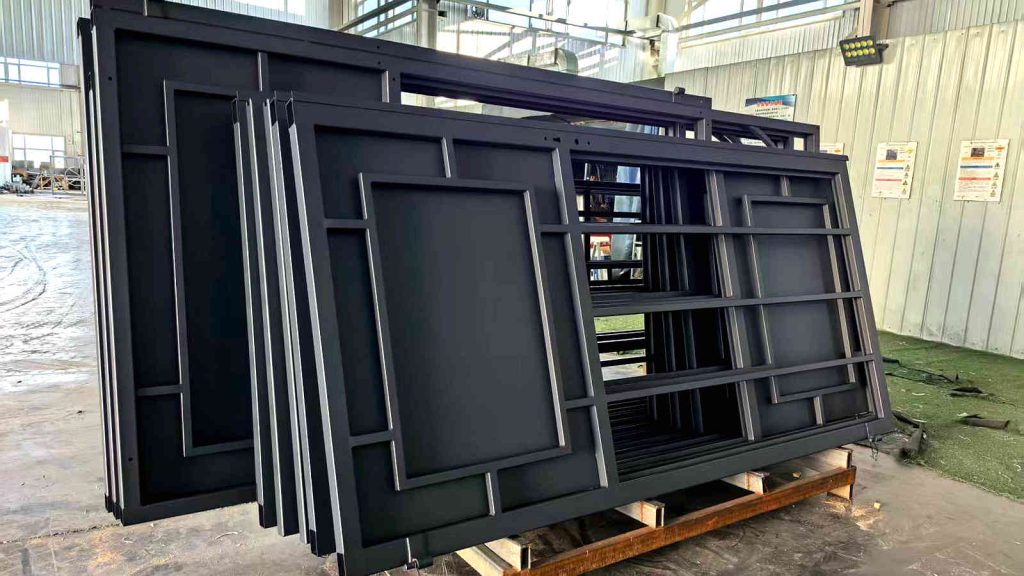 Finished and stacked giant steel panel sections with RAL7016 coated steel, ready for export as part of a 20x40m sunroom frame order.