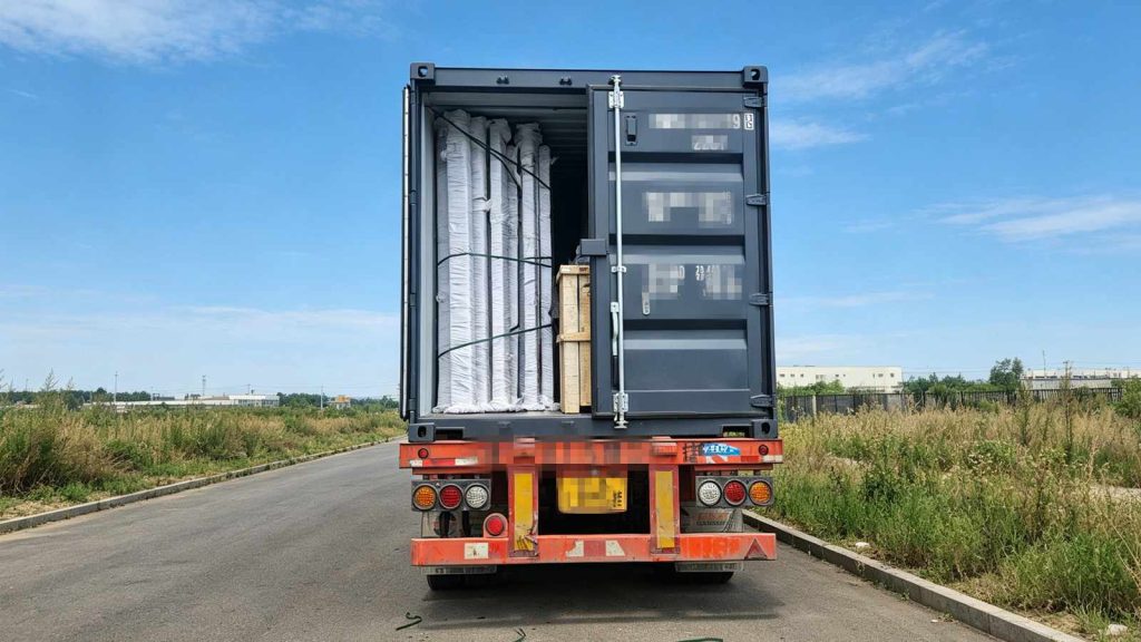 Truck carrying prefabricated sunroom heading to seaport