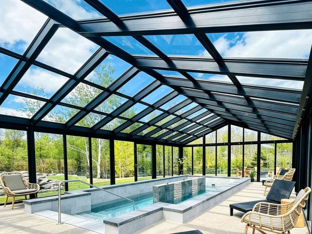 Low-E triple glazed roof pool sunroom, large glass panels overlooking green backyard trees